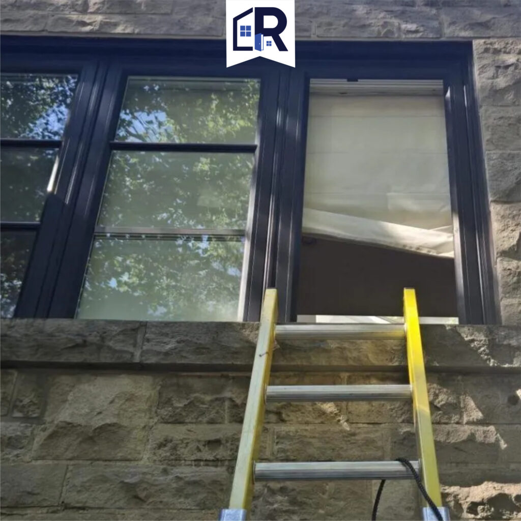 Ladder access to upstairs window during residential window repair and glass replacement service